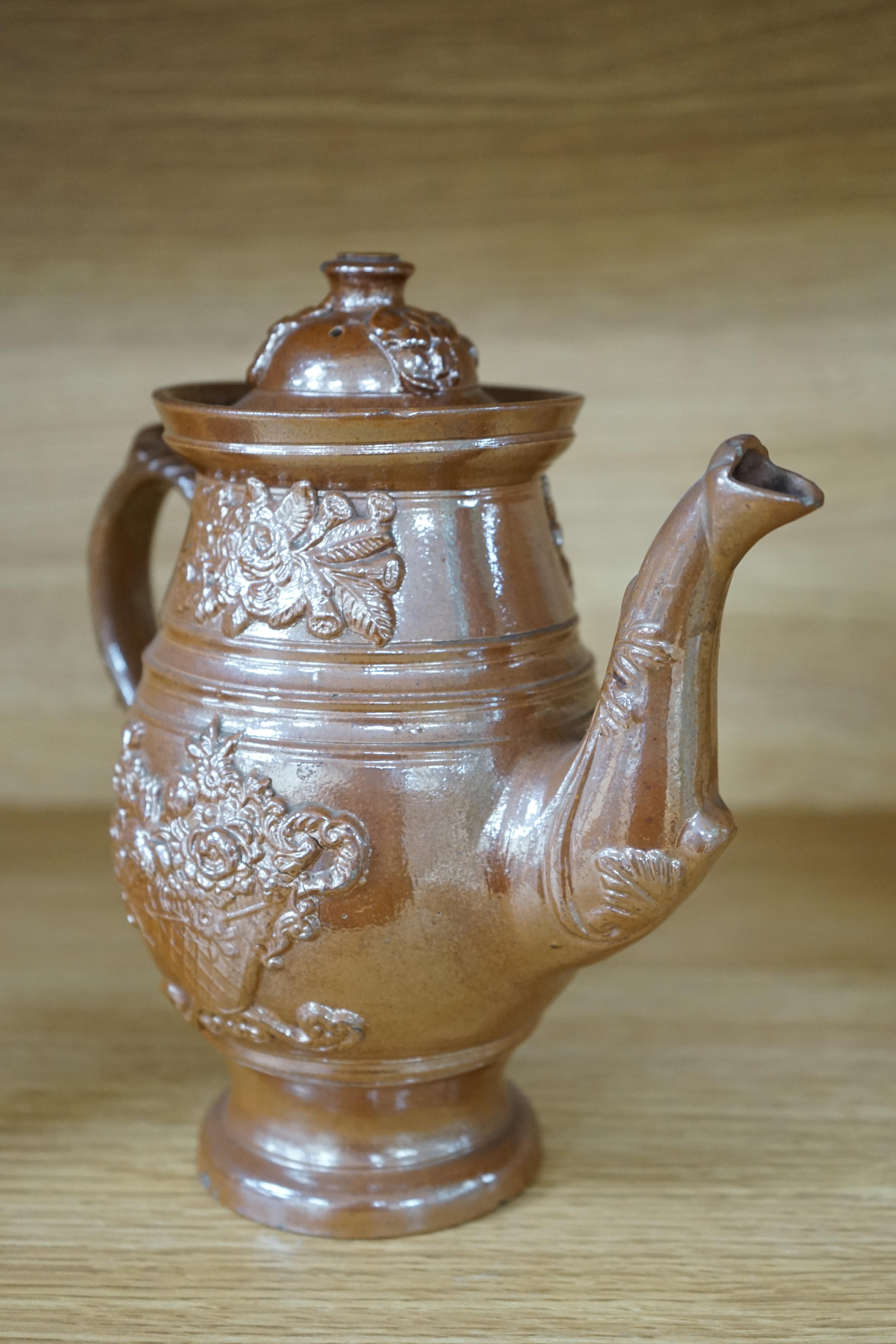 A Derbyshire salt-glaze coffee pot, 21cm high. Condition - fair, two significant chips to lid and other minor chipping.